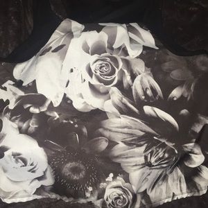 A cropped black tank shirt w/ Black & white roses